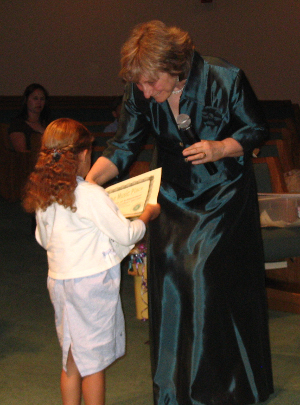 Director gives certificate at honors recital