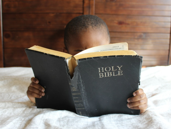 Boy reading Bible
