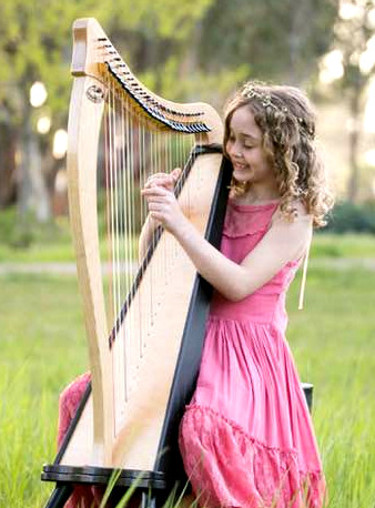 girl playing harp