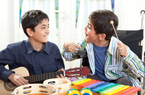 Two boys playing guitar